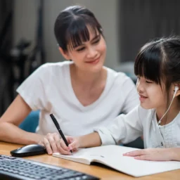 mother working with her daughter's language proficiency.