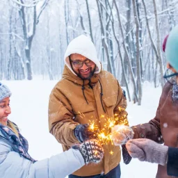 friends with sparklers in the winter.